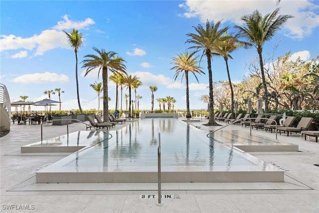 view of swimming pool featuring a patio area