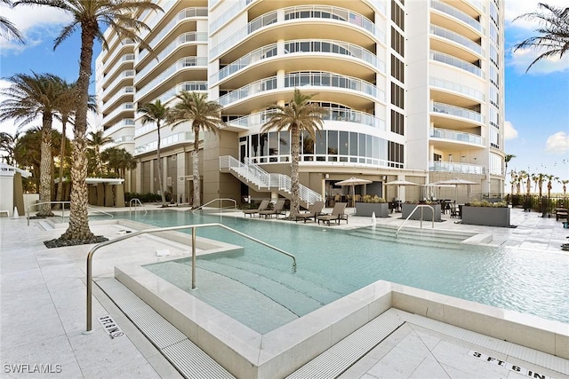 view of swimming pool featuring a patio area