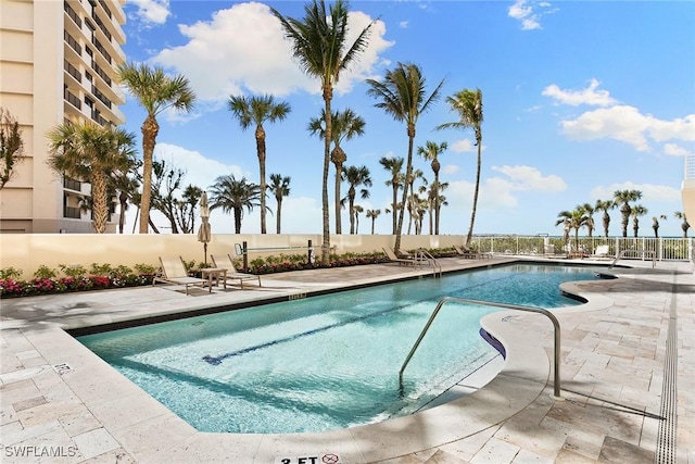 view of swimming pool with a patio area