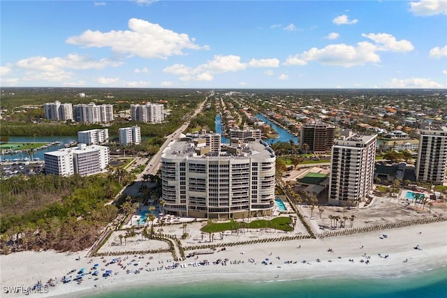 drone / aerial view with a water view and a view of the beach