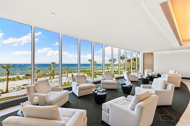 interior space with a water view and a view of the beach