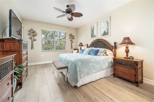 bedroom with light hardwood / wood-style floors and ceiling fan