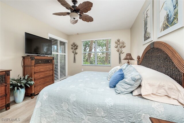 bedroom featuring ceiling fan and light hardwood / wood-style floors