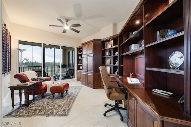 office featuring light tile patterned floors and ceiling fan