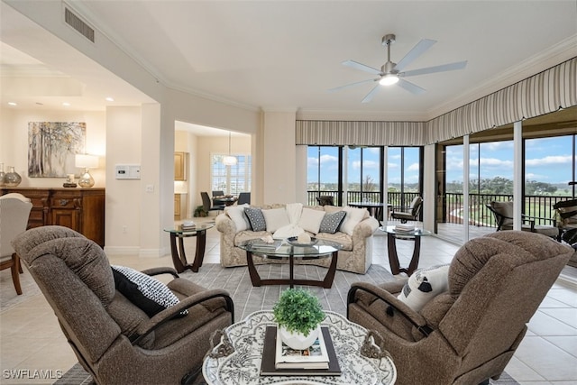 tiled living room featuring ceiling fan and ornamental molding