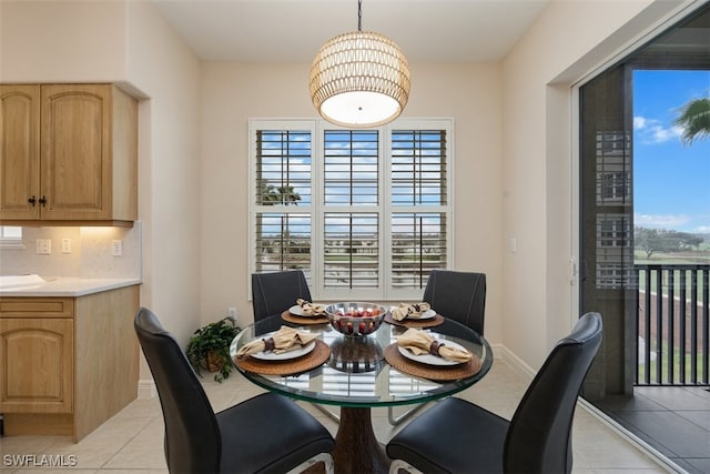 dining space featuring plenty of natural light and light tile patterned flooring