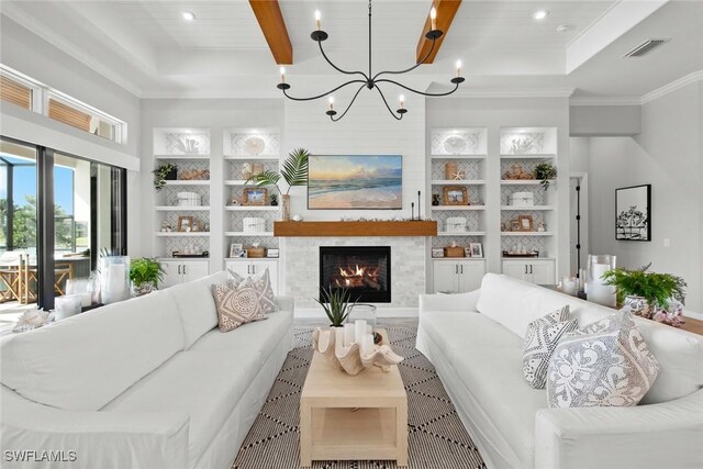 living room featuring crown molding, a notable chandelier, beam ceiling, and built in features