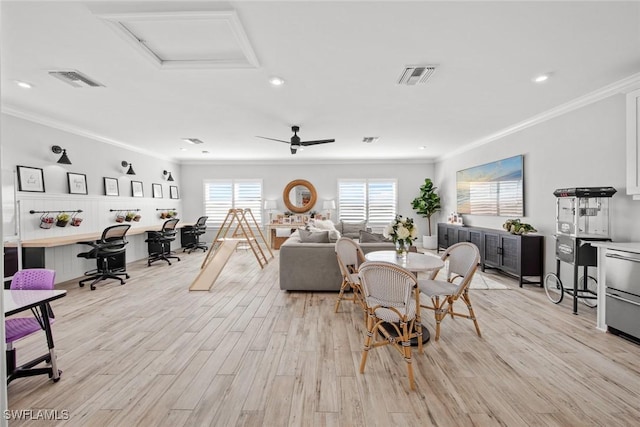 living room featuring light wood-style floors, visible vents, and ornamental molding