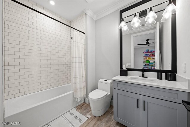 full bathroom with shower / tub combo with curtain, wood-type flooring, ornamental molding, vanity, and ceiling fan