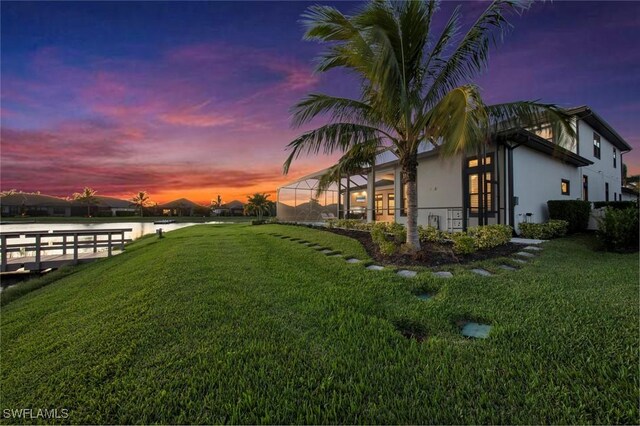 yard at dusk with a lanai