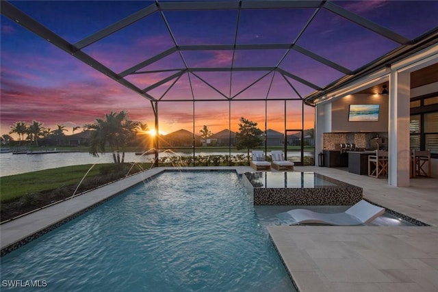 outdoor pool featuring an outdoor kitchen, a lanai, a water view, outdoor dry bar, and a patio area