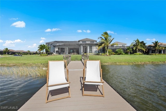 dock area featuring a yard, a lanai, and a water view