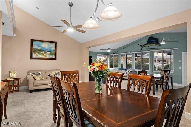 dining area featuring ceiling fan and vaulted ceiling