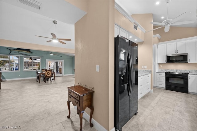 kitchen with white cabinetry, high vaulted ceiling, light stone counters, and black appliances