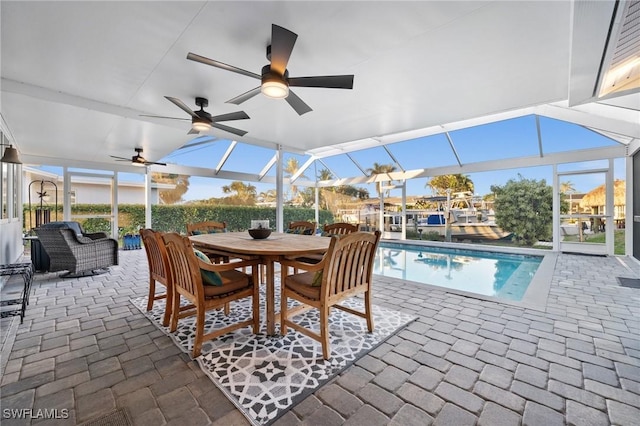 view of patio / terrace featuring outdoor lounge area and glass enclosure