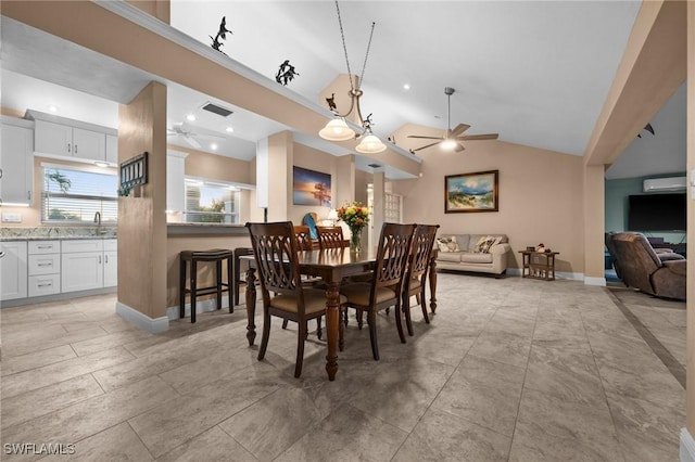 dining area featuring sink, high vaulted ceiling, and ceiling fan