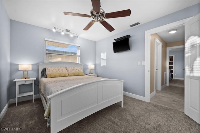 bedroom with dark carpet and ceiling fan