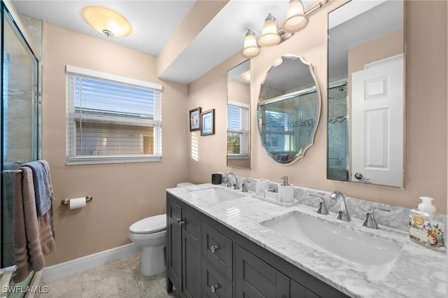 bathroom featuring vanity, tile patterned flooring, a shower with shower door, and toilet