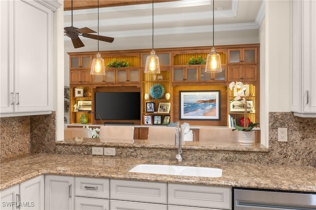 kitchen featuring sink, white cabinets, and tasteful backsplash