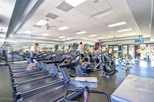 workout area featuring a paneled ceiling