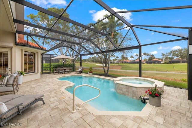 view of pool featuring an in ground hot tub, a lanai, and a patio area