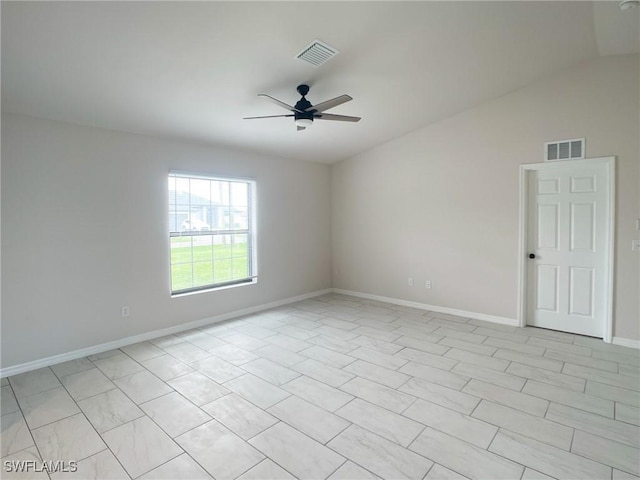 spare room with vaulted ceiling and ceiling fan