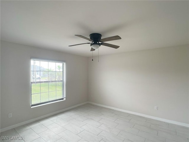 spare room with ceiling fan