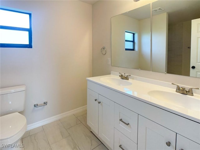 bathroom with toilet and vanity