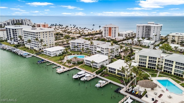 birds eye view of property with a water view