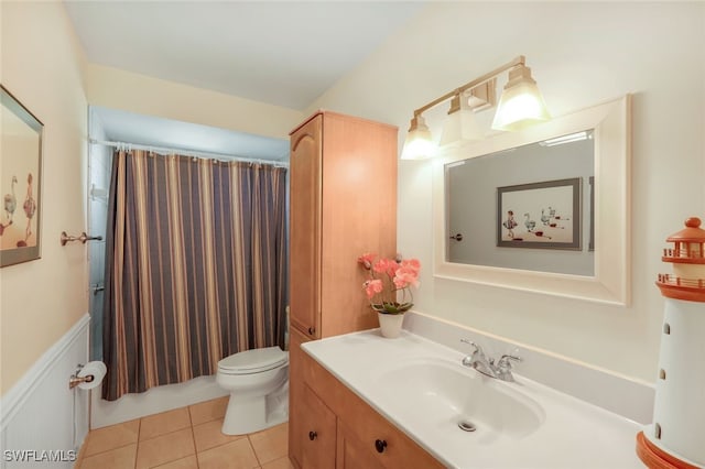 bathroom featuring tile patterned flooring, vanity, a shower with curtain, and toilet