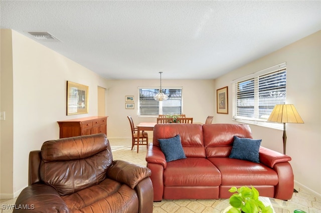 living room with a textured ceiling