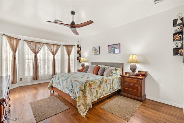 bedroom featuring ceiling fan and hardwood / wood-style floors