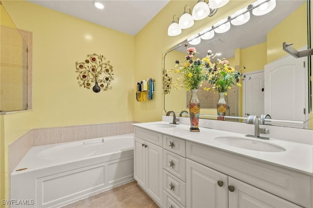 bathroom with vanity, a bath, and tile patterned floors