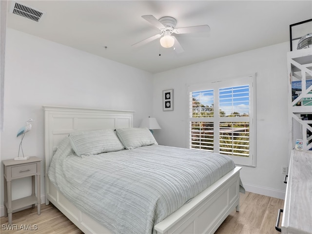 bedroom featuring light hardwood / wood-style floors and ceiling fan