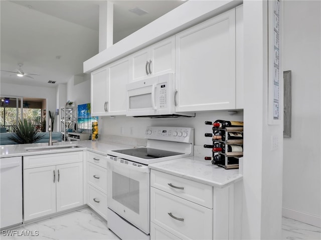 kitchen featuring white cabinets, ceiling fan, white appliances, and sink