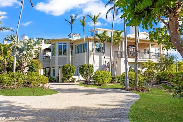 view of property with decorative driveway