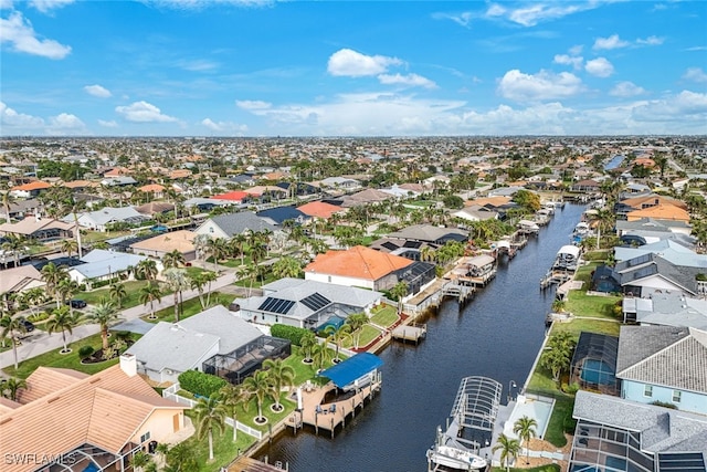 bird's eye view featuring a water view and a residential view