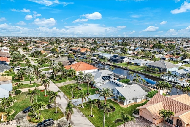 bird's eye view with a residential view and a water view