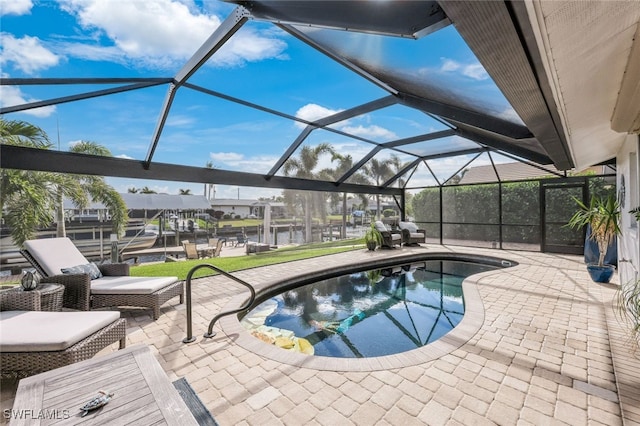 outdoor pool featuring a dock, glass enclosure, and a patio area