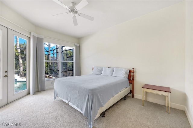 bedroom with ceiling fan, access to outside, and light carpet