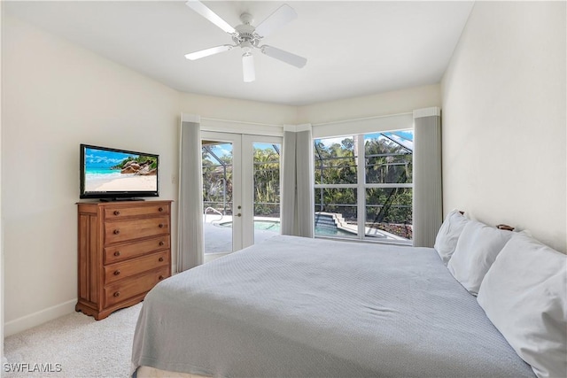 carpeted bedroom featuring ceiling fan, french doors, and access to exterior