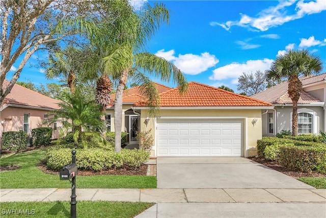 mediterranean / spanish-style house featuring a garage