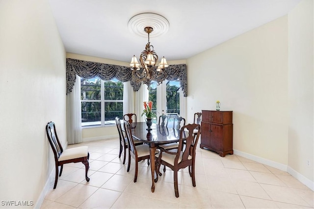 dining space with light tile patterned floors and an inviting chandelier