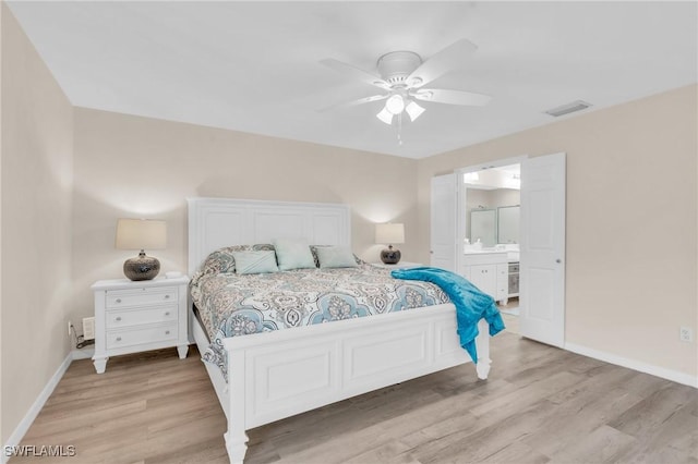 833 Reef Point Cir, Naples, FL 34108 - bedroom with ceiling fan, ensuite bathroom, and light hardwood / wood-style floors