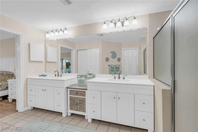 833 Reef Point Cir, Naples, FL 34108 - bathroom featuring vanity, an enclosed shower, and tile patterned flooring