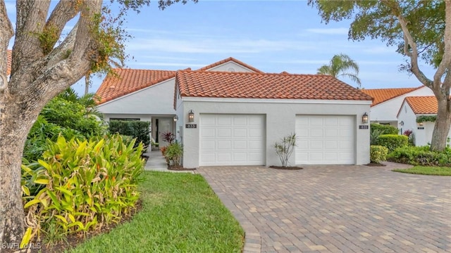 mediterranean / spanish house featuring a garage