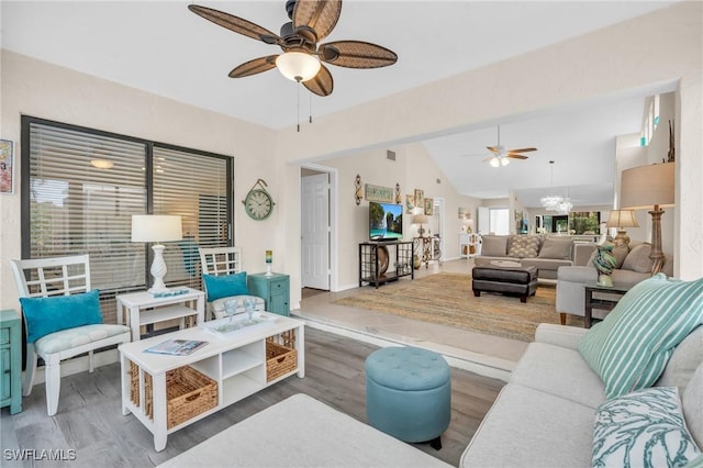 833 Reef Point Cir, Naples, FL 34108 - living room with hardwood / wood-style floors, ceiling fan with notable chandelier, and vaulted ceiling
