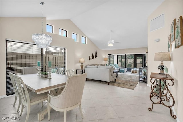 833 Reef Point Cir, Naples, FL 34108 - tiled dining area featuring ceiling fan with notable chandelier and high vaulted ceiling