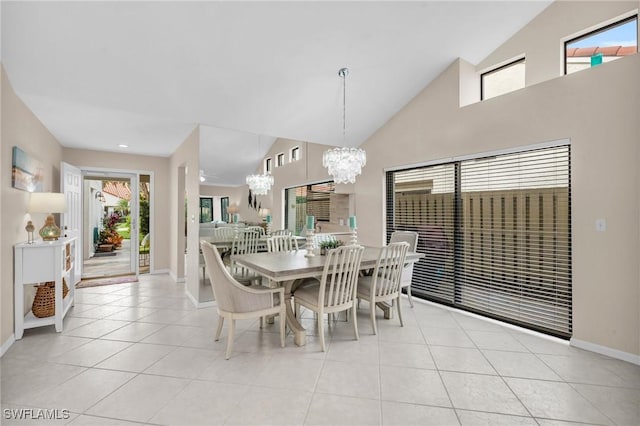 833 Reef Point Cir, Naples, FL 34108 - dining space featuring light tile patterned flooring, a chandelier, and lofted ceiling
