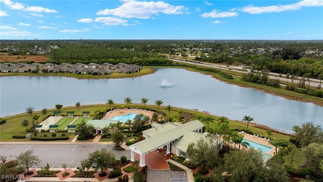 birds eye view of property with a water view